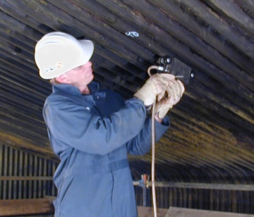 Photo of TesTex technician inspecting tubes
