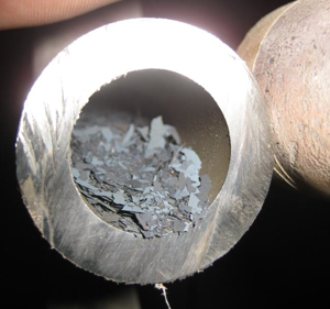 Magnetite Flakes in lower tube bend