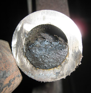 Wet Magnetite Flakes in lower tube bend